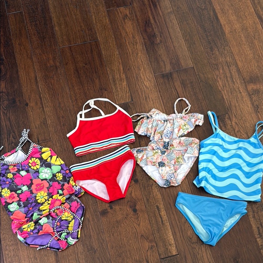 Set of 4 swimsuits.  Size 7-8
